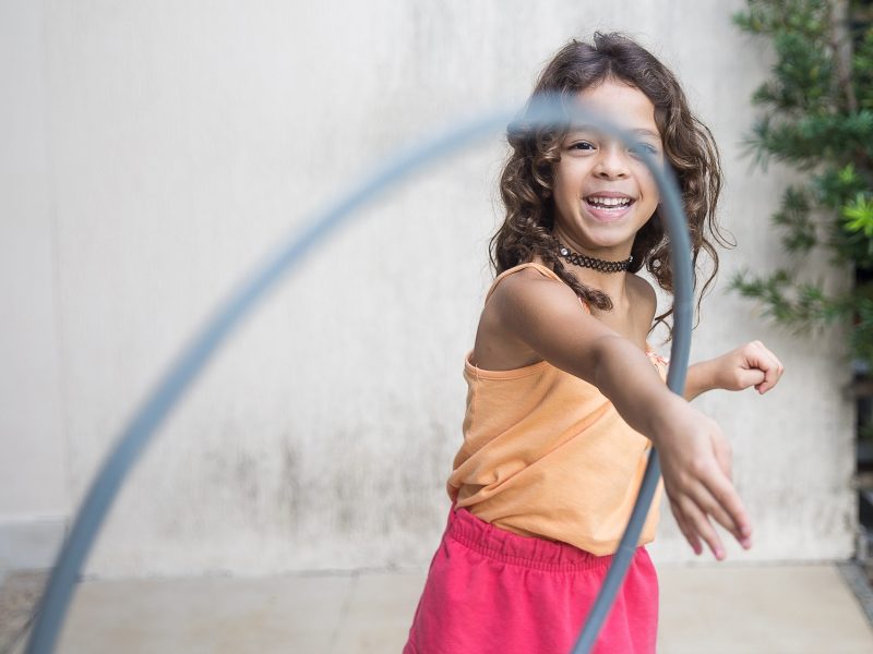 Young girl playing hoop Young girl playing hoop